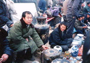 Ghost Market vendor in traditional haggling sales mode.