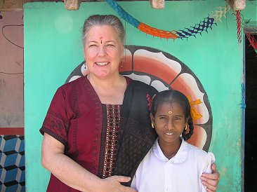 Elisabeth Sherwin in front of Sahaya House